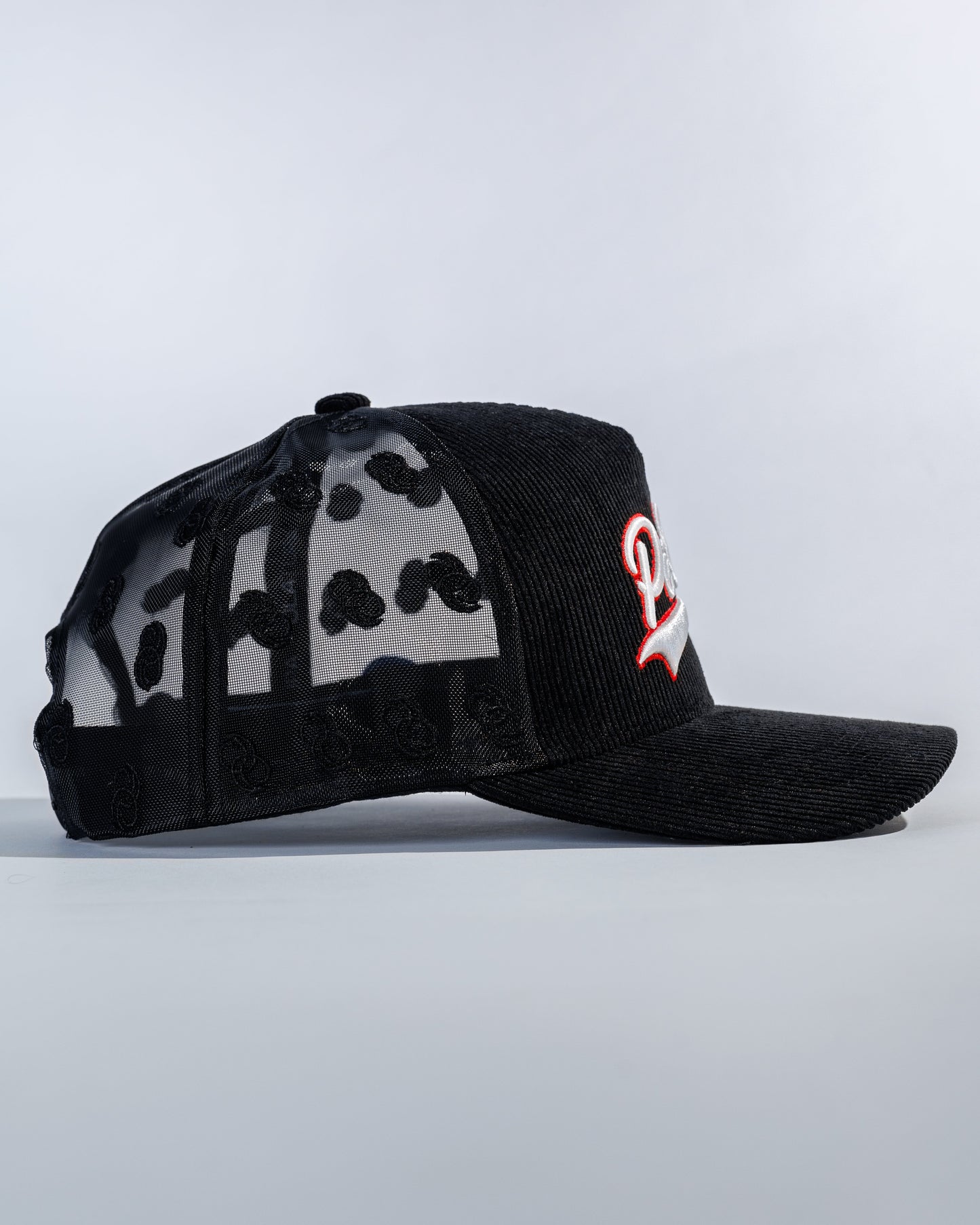 PéErre Corduroy/Mesh Pattern Trucker Cap in Black